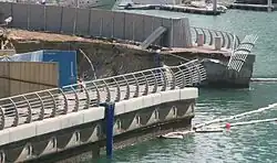 Collapsed wall and flooding at the Infinity Tower construction site