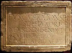 Epitaph of Fuscus at Arrien-en-Bethmale (Ariège) with reversed F to abbreviate the word filiae.