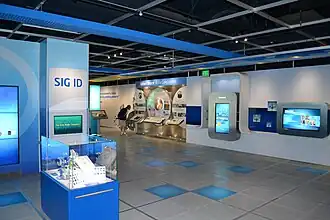 Interior view of museum, with open space and exhibits