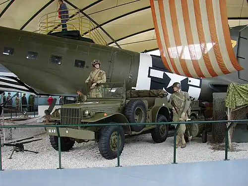 Interior exhibit showing dummies representing US soldiers, a jeep and a Douglas C-47 Skytrain aircraft