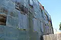 Historic tin siding on building. Pressed tin was used to fire proof many of the wooden buildings after the 1926 fire.