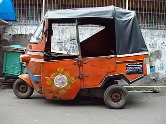 Former 2-stroke orange Bajaj in Jakarta (discontinued in 2015)