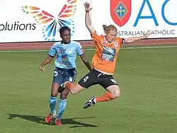 Spencer (left) playing for Sydney FC, 2014