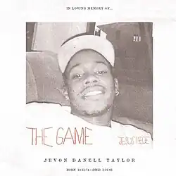 a white-bordered black and white photo of a young black man.