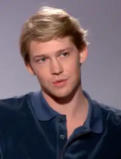 Portrait of Joe Alwyn in a blue shirt