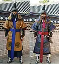 Modern reenactors wearing a complete Dujeong-gap set. While conventionally shown as red, the fabric is made of various colors.