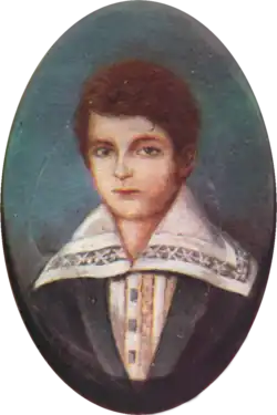 Half-length portrait of a boy with light hair and wearing a jacket over a shirt with an enormous, embroidered collar.