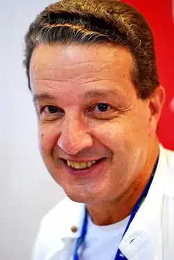 White middle aged man smiling at the camera