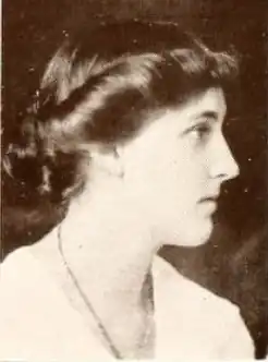 A young white woman, photographed in profile