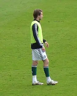 A man wearing a training kit.