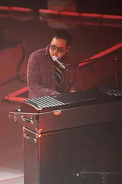 Kero One playing Fender Rhodes at a concert in 2009