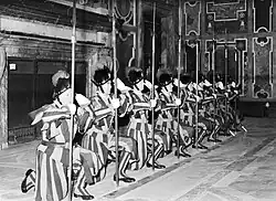 Kneeling salute in Clementine Hall, 1937