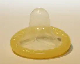 A rolled-up male condom.