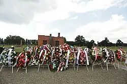 Wreaths at the memorial to the murdered Sinti and Roma in the Auschwitz-Birkenau concentration and extermination camp on 2 August 2019