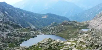 A body of water surrounded by mountainous terrain.
