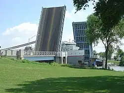 The drawbridge with a freighter passing underneath