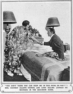 Bedroom scene with young woman resisting the advances of a man