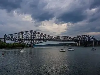 A cantilever truss bridge, Quebec Bridge over the Saint Lawrence River in Quebec, Canada