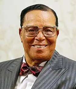 Louis Farrakhan smiling while facing the camera.