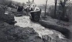 Lt. Gov. S. Hollister Jackson car in running water after the flood of 1927 in Vermont.