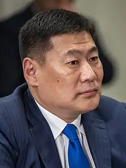 Chest-length photo of Oyun-Erdene wearing a suit