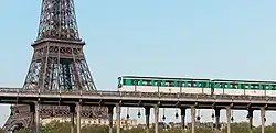 Line 6 train running on the Pont de Bir-Hakeim near the Eiffel Tower