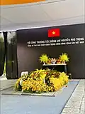 The funeral of Nguyễn Phú Trọng, displaying the Vietnamese flag with a black ribbon on the top right corner.