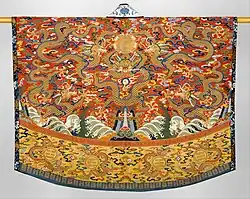 Daoist Robe, 17th Century 'Robe embroidered with 5 dragons hovering over a landscape of mountains and ocean, likely worn by a Taoist priest during ceremonies.