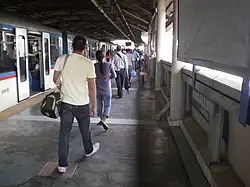 Vast platform area with a train in the station