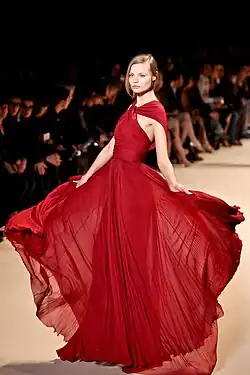 Magdalena Frąckowiak wearing a cherry colored gown.