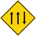Three-lane carriageway ahead, with one lane in the opposing direction