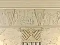 Ground level cornice panel depicting First Nations people