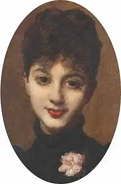 Young white woman with dark hair looking towards the viewer