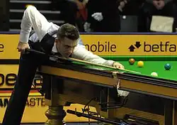 Selby playing a shot