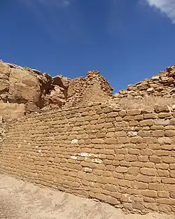 A color picture of a large sandstone masonry wall