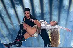 Dancer Urquiaga holding Melody after the final pirouette performed at the end of their performance at the Eurovision first semi-final.