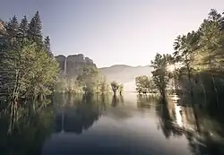 Sunrise over the Merced River as seen from Swinging Bridge in June 2023.