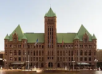 The station's design preserves the view of Minneapolis City Hall, an ornate Richardsonian Romanesque design.