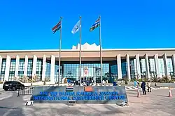 A street with cars and a sidewalk with
