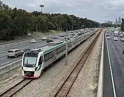 Electric passenger train viewed from a bridge
