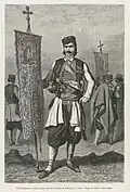 A Montenegrin Orthodox Priest before battle wearing his cap, 1876