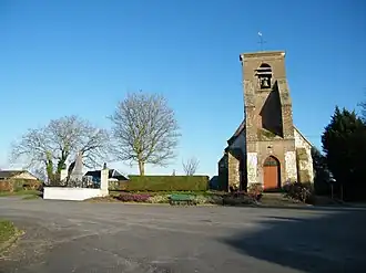 The war memorial and church in Saigneville