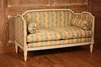 A two-seater upholstered loveseat