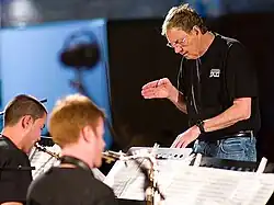 (L–R) Michel Machietto (alto sax), Isaac Lamar (tenor sax), Neil Slater conducting the One O'Clock Lab Band at the Umbria Jazz Festival, July 18, 2008