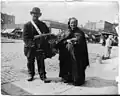 New York City, 1897. The organ grinder and his wife