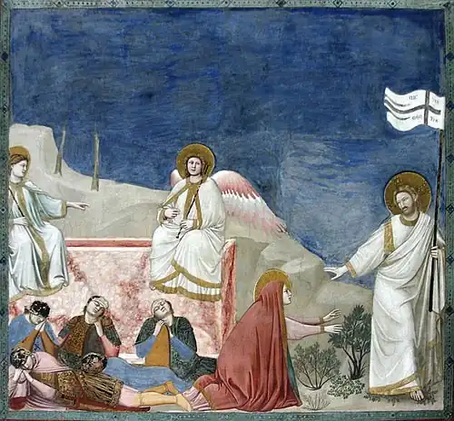 A square fresco. In a shallow stage-like space is shown the empty tomb of Jesus, like a rectangular box of pink marble. Two angels sit on its edge while four Roman soldiers lie sprawled asleep in front of it. To the extreme right, walking out of the picture frame, is Jesus, robed in white and carrying a banner symbolising Victory. He gestures to restrain Mary Magdalene, who kneels at the centre of the picture in a red cloak, and reaches out both hands to touch him.