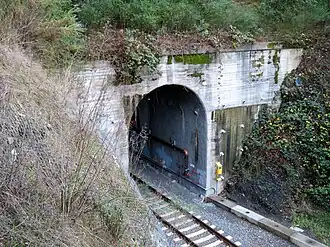 A concrete portal of an arched tunnel