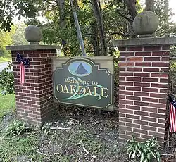 Sign on Oakdale-Bohemia road greeting passersby