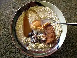 Porridge made from 1-minute quick-cooking rolled oats with raisins, peanut butter, honey, and cinnamon