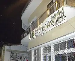 Balcony of occupied building at Occupy Buffer Zone. The banner refers to the Cyprus Dispute.